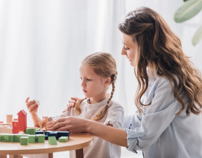 Child and caretaker playing together